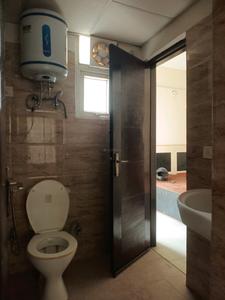 Common Bathroom Image of 990 Sq.ft 2 BHK Apartment / Flat for sale in Ajnara Le Garden, Noida Extension Greater Noida for Rs. 7900000