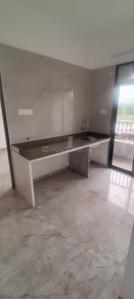 Kitchen Image of 765 Sq.ft 1 BHK Apartment / Flat for sale in Rudis Shivalaya Heights, Khidkali Thane for Rs. 3900000