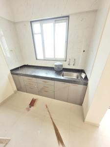 Kitchen Image of 690 Sq.ft 1 BHK Apartment / Flat for rent in Surya Nagari society, Pimple Gurav Pune for Rs. 15000