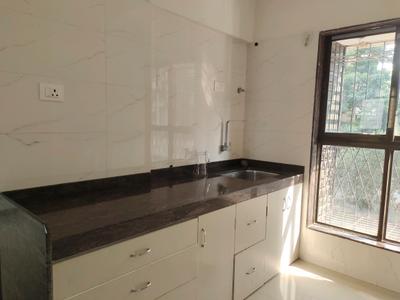 Kitchen Image of 600 Sq.ft 1 BHK Apartment / Flat for sale in Dharti Pressidio, Malad West Mumbai for Rs. 9300000