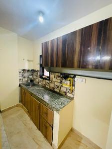 Kitchen Image of 450 Sq.ft 1 BHK Apartment / Flat for sale in Rajpur Khurd Extension New Delhi for Rs. 1800000