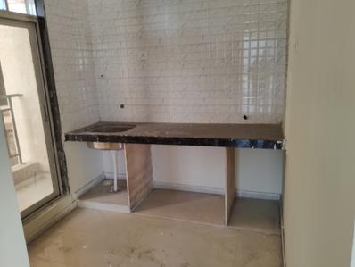 Kitchen Image of 710 Sq.ft 1 BHK Apartment / Flat for sale in Pushpak Nagar Navi Mumbai for Rs. 4400000