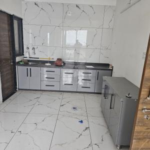 Kitchen Image of 748 Sq.ft 3 BHK Apartment / Flat for sale in Samarpan Shiv Ganga Sky, Nagalpur Part Mehsana for Rs. 4250000