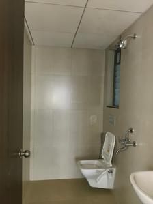 Common Bathroom Image of 780 Sq.ft 2 BHK Apartment / Flat for rent in Runwal My City Phase II Cluster 5 Part III, Usarghar Thane for Rs. 15000