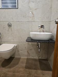 Common Bathroom Image of 1450 Sq.ft 3 BHK Apartment / Flat for sale in Kosmic Kourtyard Phase 1, Wagholi Pune for Rs. 8500000