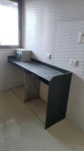 Kitchen Image of 660 Sq.ft 1 BHK Apartment / Flat for sale in Vishesh Balaji Symphony, Shilottar Raichur Navi Mumbai for Rs. 4800000
