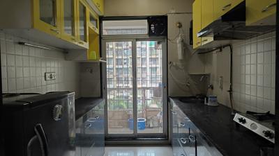 Kitchen Image of 1115 Sq.ft 2 BHK Apartment / Flat for rent in Gajra Bhoomi Gardenia, Kalamboli Navi Mumbai for Rs. 34000