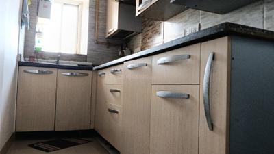 Kitchen Image of 935 Sq.ft 2 BHK Apartment / Flat for rent in CGHS Rail Vihar, Sector 15 Gurgaon for Rs. 35000