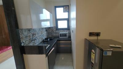 Kitchen Image of 800 Sq.ft 1 BHK Builder Floor for rent in Sector 52 Gurgaon for Rs. 30000