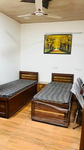 Bedroom Image of Baisla PG in Kotla Mubarakpur, New Delhi