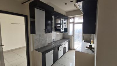 Kitchen Image of 1340 Sq.ft 3 BHK Apartment / Flat for sale in Ajnara Homes, Noida Extension Greater Noida for Rs. 11800000