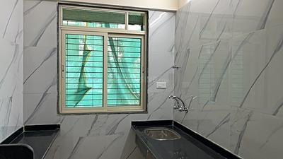 Kitchen Image of 710 Sq.ft 1 BHK Apartment / Flat for sale in Mohan Willows III, Badlapur East Badlapur for Rs. 2850000