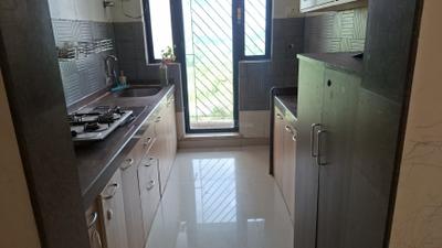 Kitchen Image of 1120 Sq.ft 2 BHK Apartment / Flat for rent in Tharwani Riviera, Kharghar Navi Mumbai for Rs. 34500