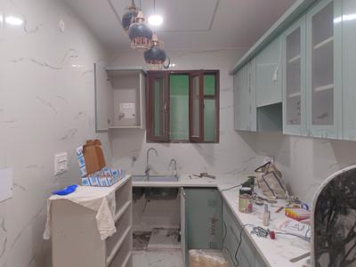 Kitchen Image of 1000 Sq.ft 3 BHK Apartment / Flat for sale in Fairdeal Burari Dream Homes, Burari New Delhi for Rs. 5500000