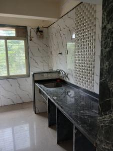 Kitchen Image of 695 Sq.ft 1 BHK Apartment / Flat for rent in Mohan Palms, Badlapur East Badlapur for Rs. 9000