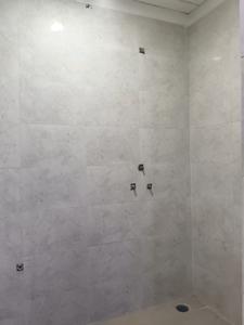 Common Bathroom Image of 1010 Sq.ft 2 BHK Apartment / Flat for sale in Trinity Krishna Kunj, Noida Extension Greater Noida for Rs. 4504500