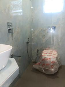 Common Bathroom Image of 1240 Sq.ft 2 BHK Apartment / Flat for sale in NMS One 27, Kharghar Navi Mumbai for Rs. 15000000