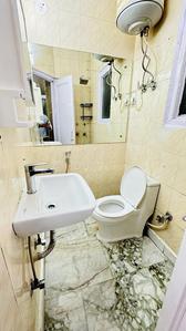 Bathroom Image of 500 Sq.ft 1 RK Builder Floor for rent in Lajpat Nagar New Delhi for Rs. 22000