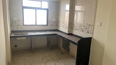 Kitchen Image of 900 Sq.ft 2 BHK Apartment / Flat for sale in Raj Tulsi Aawas, Badlapur East Badlapur for Rs. 3100000