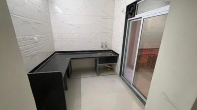 Kitchen Image of 850 Sq.ft 2 BHK Apartment / Flat for sale in Shreeji Krishna Nayan Complex Phase I, Badlapur East Badlapur for Rs. 3455000