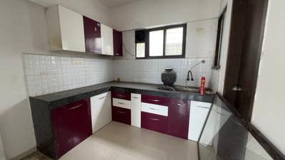 Kitchen Image of 670 Sq.ft 1.5 BHK Apartment / Flat for sale in Majestique Palm Atlantis, Wagholi Pune for Rs. 3900000