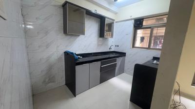 Kitchen Image of 1005 Sq.ft 2 BHK Apartment / Flat for sale in Vishesh Balaji Symphony, Panvel Navi Mumbai for Rs. 7850000