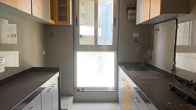 Kitchen Image of 900 Sq.ft 2 BHK Apartment / Flat for sale in Goodwill Unity, Sanpada Navi Mumbai for Rs. 23000000