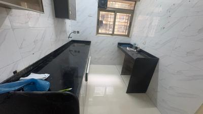 Kitchen Image of 1005 Sq.ft 2 BHK Apartment / Flat for sale in Vishesh Balaji Symphony, Panvel Navi Mumbai for Rs. 7850000