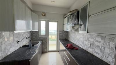 Kitchen Image of 1300 Sq.ft 3 BHK Apartment / Flat for sale in Samridhi Grand Avenue, Noida Extension Greater Noida for Rs. 13900000