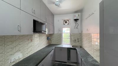 Kitchen Image of 1200 Sq.ft 2 BHK Builder Floor for rent in Janakpuri New Delhi for Rs. 37000