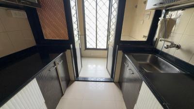 Kitchen Image of 900 Sq.ft 2 BHK Apartment / Flat for rent in Kulswamini Goraksha Dham, Borivali East Mumbai for Rs. 50000