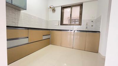 Kitchen Image of 1050 Sq.ft 2 BHK Apartment / Flat for rent in Raja Bahadur Pittie Kourtyard D Tower, Kharadi Pune for Rs. 41000