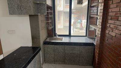 Kitchen Image of 696 Sq.ft 2 BHK Apartment / Flat for sale in Arete Our Homes 3, Sector 6 Sohna for Rs. 5500000