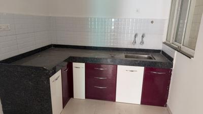 Kitchen Image of 950 Sq.ft 2 BHK Apartment / Flat for sale in Majestique Manhattan G Building, Wagholi Pune for Rs. 5200000