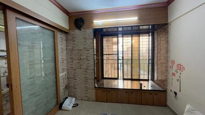 Living Room Image of 560 Sq.ft 1 BHK Apartment / Flat for sale in Suyash Tower, Kopar Khairane Navi Mumbai for Rs. 9900000