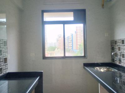 Kitchen Image of 700 Sq.ft 1 BHK Apartment / Flat for sale in Mohan Precious Greens Phase I, Ambernath East Ambernath for Rs. 3500000