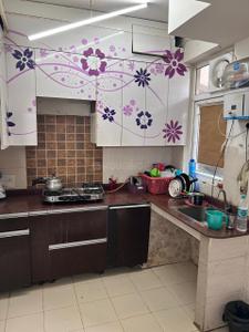 Kitchen Image of 950 Sq.ft 2 BHK Apartment / Flat for rent in Amrapali Zodiac, Sector 120 Noida for Rs. 25000