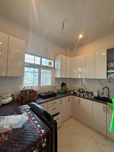 Kitchen Image of 945 Sq.ft 2 BHK Builder Floor for rent in Gaur Yamuna City, Yeida Greater Noida for Rs. 26000