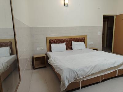 Bedroom Image of Smart Living PG in Sector 63, Noida