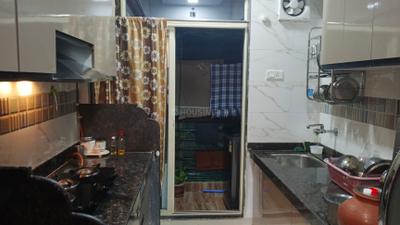 Kitchen Image of 960 Sq.ft 2 BHK Apartment / Flat for sale in Manohar Vikas Shreeji Paraiso Phase 2, Badlapur East Badlapur for Rs. 5350000