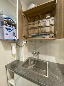 Kitchen Image of 1000 Sq.ft 1 BHK Studio for rent in DLF Phase 5 Gurgaon for Rs. 26000