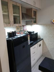 Kitchen Image of 450 Sq.ft 1 BHK Apartment / Flat for rent in Emami Tejomaya, Navalur Chennai for Rs. 150000