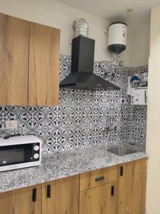 Kitchen Image of 650 Sq.ft 1 RK Builder Floor for rent in CGHS Milan, Sector 39 Gurgaon for Rs. 24000