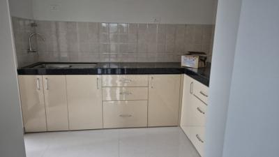 Kitchen Image of 1033 Sq.ft 2 BHK Apartment / Flat for rent in Shapoorji Pallonji Joyville Sensorium, Maan Pune for Rs. 25009