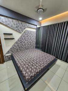 Bedroom Image of 1100 Sq.ft 3 BHK Apartment / Flat for rent in Shambhu Savan Signet, Radhika Park Rajkot for Rs. 34000