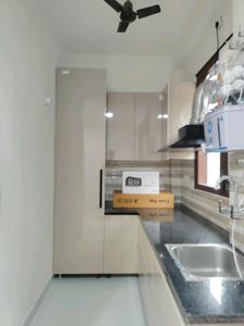 Kitchen Image of 950 Sq.ft 2 BHK Builder Floor for rent in Sector 57 Gurgaon for Rs. 45000