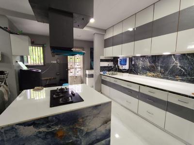 Kitchen Image of Samarth PG in Piplod, Surat