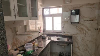 Kitchen Image of 729 Sq.ft 1 BHK Apartment / Flat for rent in KSA Palms, Agripada Mumbai for Rs. 65000