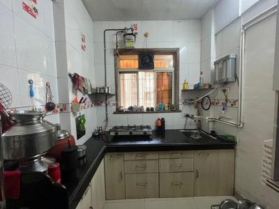 Kitchen Image of 930 Sq.ft 2 BHK Apartment / Flat for sale in Thakurli Thane for Rs. 6900000