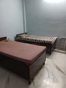 Bedroom Image of Singh pg in Shahdara, New Delhi